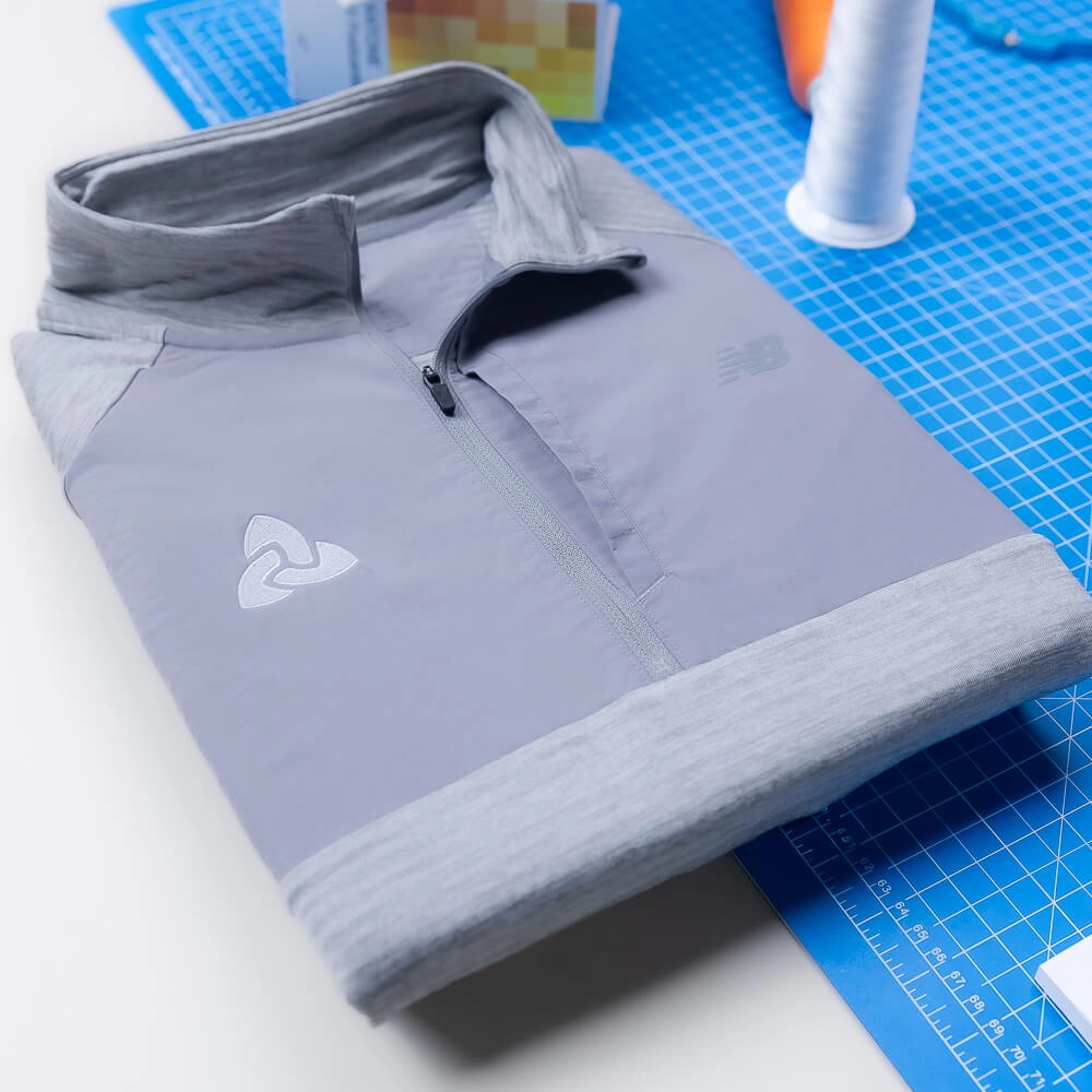 Custom New Balance clothing delivers comfort, mobility, and a polished athletic aesthetic. 